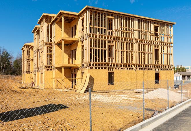 a close-up of temporary chain link fences enclosing a job site, signaling progress in the project's development in Canyon Lake CA